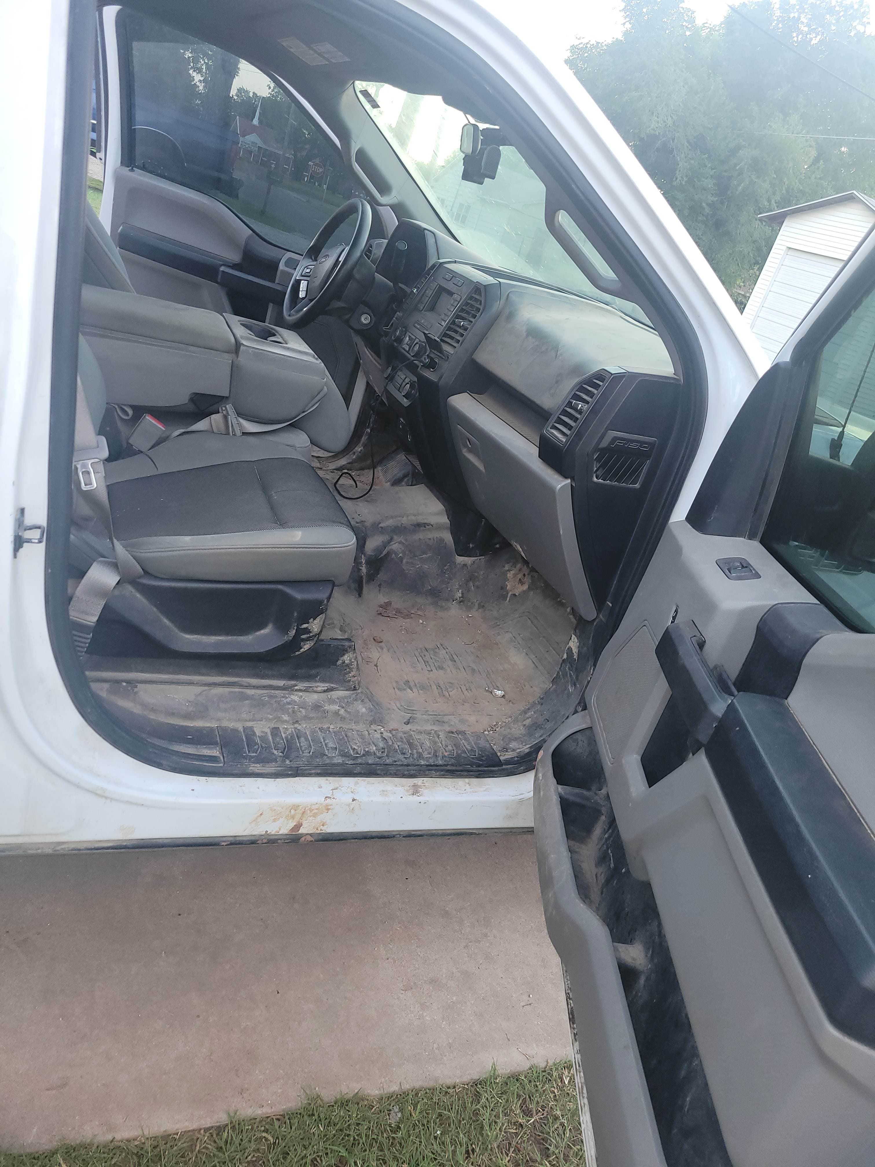 Very dirty work truck interior before exterior car detailing service in OKC