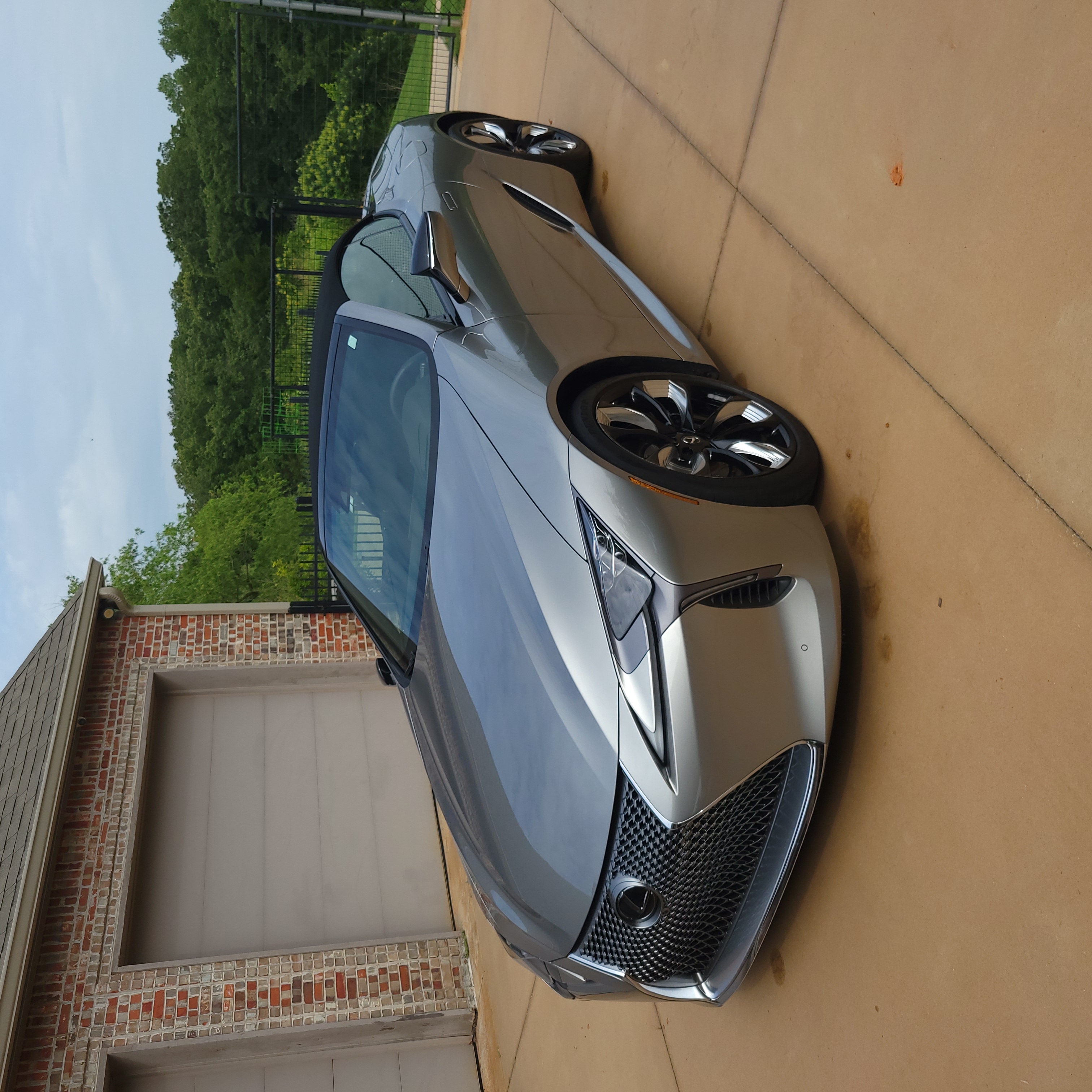 Luxury silver Lexus LC500 convertible with a flawless finish.
